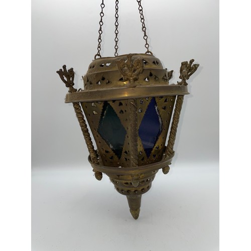 708 - BRASS CAGED AND OCTAGONAL PANEL GLASS HANGING HALL LANTERN