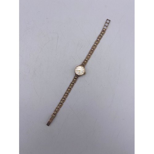 589 - LADIES 9CT GOLD CASED ACCURIST WRIST WATCH 10.3G OVERALL