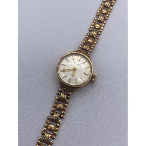 589 - LADIES 9CT GOLD CASED ACCURIST WRIST WATCH 10.3G OVERALL