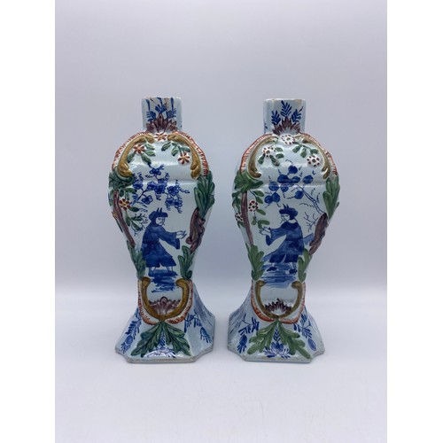 740 - PAIR OF DUTCH DELFT POTTERY VASES OF TAPERED FORM DECORATED WITH CHINESE FIGURES AS FOUND