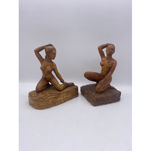 665 - TWO WOODEN CARVINGS OF KNEELING BURMESE FEMALES SIGNED AND DATED 1960S GEORGE W DICKER