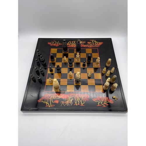 640 - BLACK LACQUERED COMPACT CHESS SET WITH CARVED HORN PIECES A/F