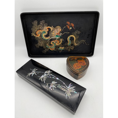 649 - MOTHER OF PEARL BLACK LACQUERED OBLONG BOX AND LACQUERED DRAGON DECORATED TRAY AND HEART TRINKET BOX