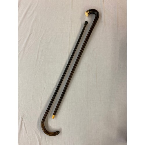 755 - EBONY WALKING CANE WITH BONE HANDLE DETAIL AND ONE OTHER