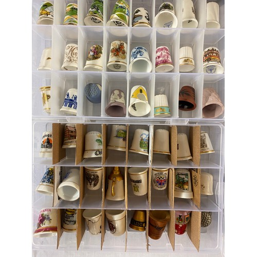 686 - LARGE QUANTITY OF PORCELAIN, ENAMELLED AND METAL THIMBLES WITH RACKS AND STANDS