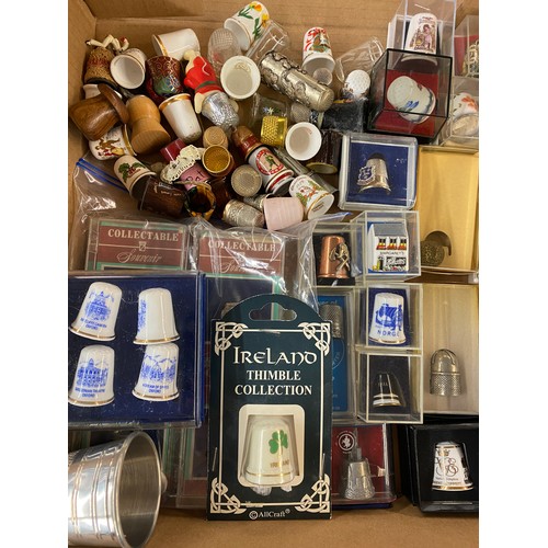 686 - LARGE QUANTITY OF PORCELAIN, ENAMELLED AND METAL THIMBLES WITH RACKS AND STANDS