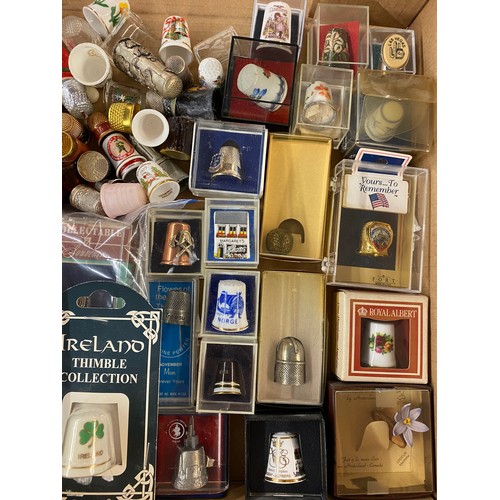 686 - LARGE QUANTITY OF PORCELAIN, ENAMELLED AND METAL THIMBLES WITH RACKS AND STANDS