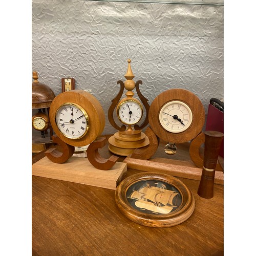 350 - SHELF OF TREEN, TURNED WOODEN GOBLETS, BOWLS, WOODEN MOUNTED CLOCKS, AND BAROMETER