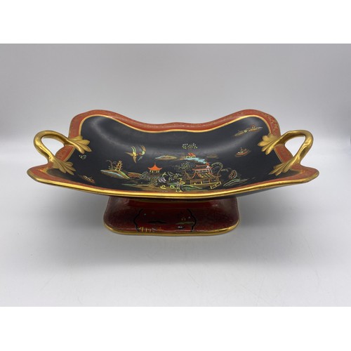 363 - CARLTONWARE GILDED TWIN HANDLED COMPORT AND CARLTONWARE BLACK GROUND FANCIFUL BIRD BOWL