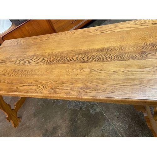 130 - SUPERB QUALITY OAK SPANISH STYLE DINING TABLE WITH WROUGHT IRON WORK STRETCHERS AND A SIMILAR STYLE ... 