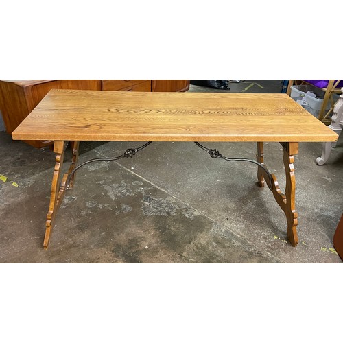 130 - SUPERB QUALITY OAK SPANISH STYLE DINING TABLE WITH WROUGHT IRON WORK STRETCHERS AND A SIMILAR STYLE ... 