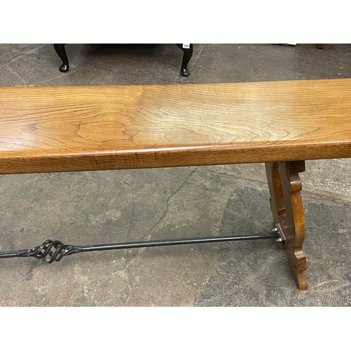 130 - SUPERB QUALITY OAK SPANISH STYLE DINING TABLE WITH WROUGHT IRON WORK STRETCHERS AND A SIMILAR STYLE ... 