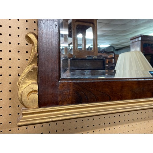 147 - REPRODUCTION DARK WOOD AND PARCEL GILDED REGENCY STYLE PIER MIRROR