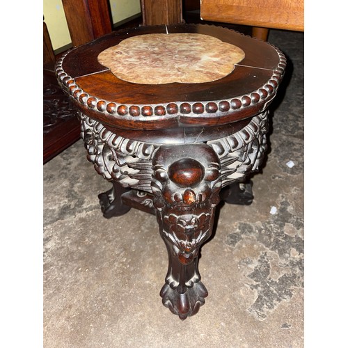 150 - EASTERN HARDWOOD CARVED JARDINIERE STAND WITH LOBED TOP INSET WITH MARBLE PANEL AND CARVED FACEMASK ... 