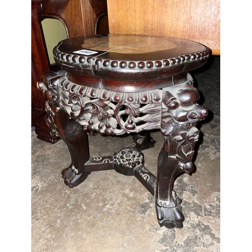 150 - EASTERN HARDWOOD CARVED JARDINIERE STAND WITH LOBED TOP INSET WITH MARBLE PANEL AND CARVED FACEMASK ... 