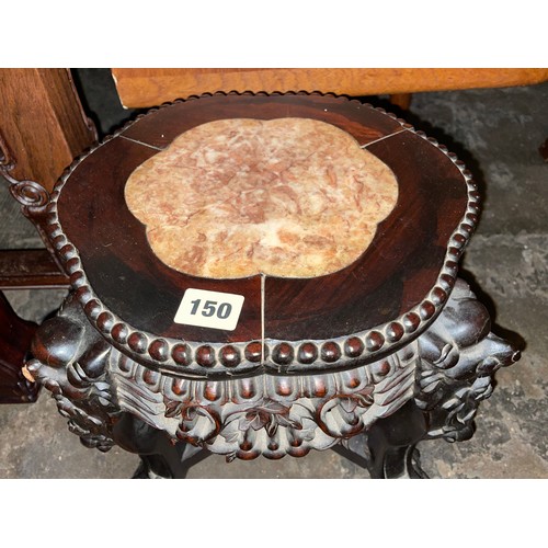 150 - EASTERN HARDWOOD CARVED JARDINIERE STAND WITH LOBED TOP INSET WITH MARBLE PANEL AND CARVED FACEMASK ... 