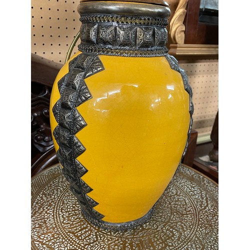 227 - YELLOW GLAZED POTTERY OVOID TABLE LAMP WITH METAL WORK MOUNTS