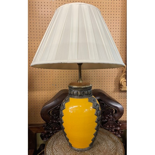 227 - YELLOW GLAZED POTTERY OVOID TABLE LAMP WITH METAL WORK MOUNTS