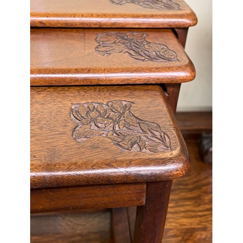 135 - NEST OF THREE SMALL HARDWOOD EASTERN CARVED TABLES