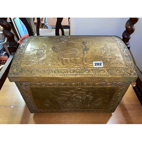 202 - BRASS EMBOSSED DOME TOPPED LOG BOX WITH LION MASK HANDLES