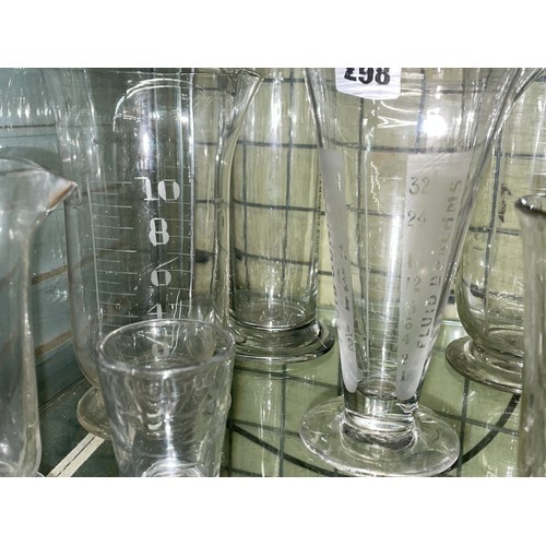 298 - HALF SHELF OF KITCHEN GLASS MEASURING BEAKERS