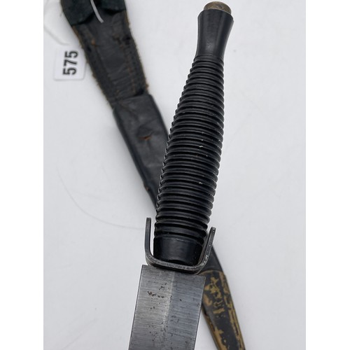 575 - ROYAL MARINES COMMANDOS KNIFE IN A LEATHER SCABBARD