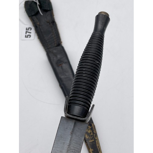 575 - ROYAL MARINES COMMANDOS KNIFE IN A LEATHER SCABBARD