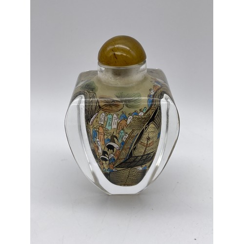 581 - REVERSE PAINTED CHINESE GLASS SNUFF BOTTLE WITH DOME STOPPER