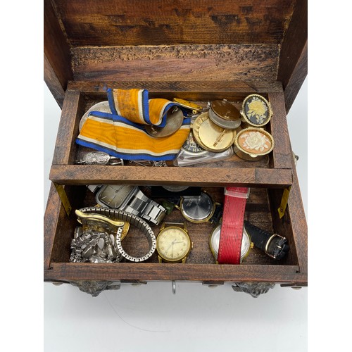 527 - CANTILEVER CASKET CONTAINING ENAMEL COIN, PENDANTS ON TRACE CHAINS, WRIST WATCHES, BADGES, CROWNS, A... 