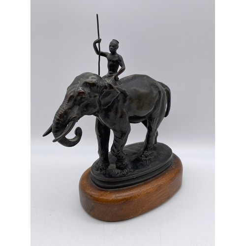 517 - 19TH CENTURY ALF BARYE ANIMALIER BRONZE OF AN ELEPHANT WITH HANDLER ON A WOODEN SOCLE