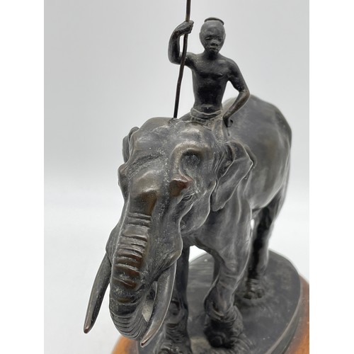 517 - 19TH CENTURY ALF BARYE ANIMALIER BRONZE OF AN ELEPHANT WITH HANDLER ON A WOODEN SOCLE