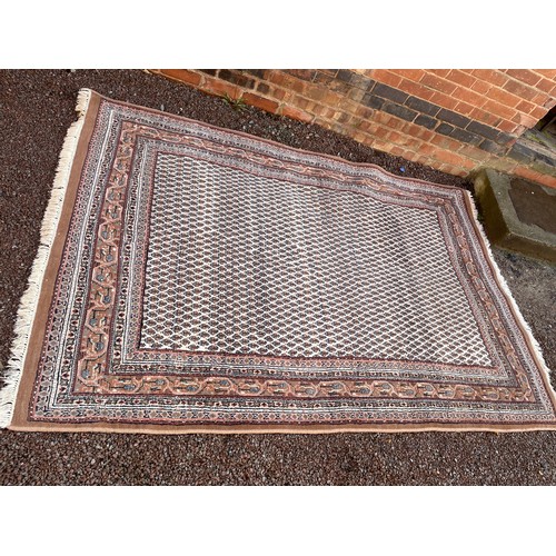 61 - 20TH CENTURY CAUCASIAN CARPET WITH LOZENGES ON CREAM GROUND AND PATTERN BORDERS 247x 169