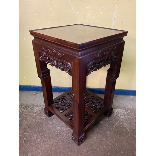 149 - CHINESE HARDWOOD SQUARE SECTION TABLE WITH CARVED AND FRET CARVED FRIEZE AND UNDER TIER