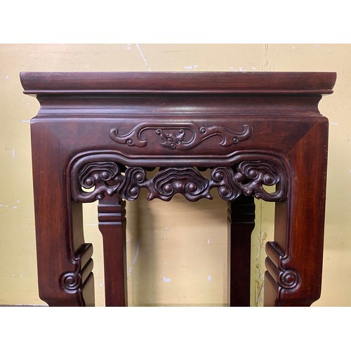 149 - CHINESE HARDWOOD SQUARE SECTION TABLE WITH CARVED AND FRET CARVED FRIEZE AND UNDER TIER