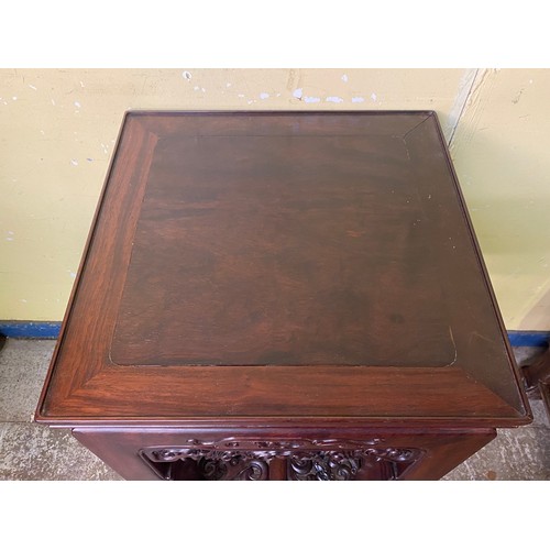 149 - CHINESE HARDWOOD SQUARE SECTION TABLE WITH CARVED AND FRET CARVED FRIEZE AND UNDER TIER