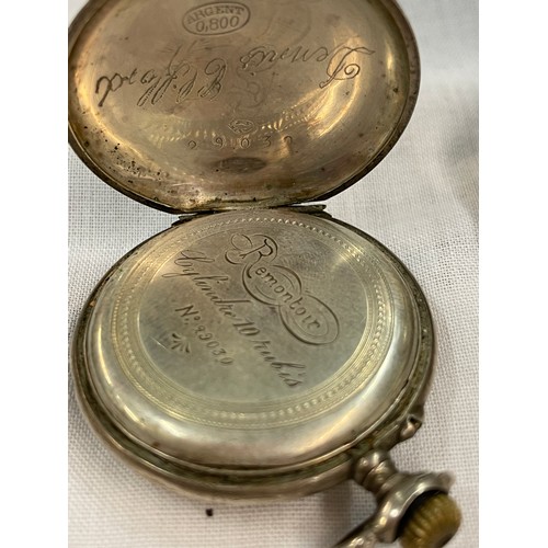 547 - 800 WHITE METAL CASED FOB WATCH AS FOUND AND A SILVER CASED POCKET WATCH AND A BASE METAL EXAMPLE AS... 