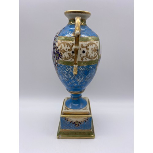 503 - PAIR OF NORITAKE BLUE AND GILT TWIN HANDLED VASES WITH PANELS DEPICTING RIVER SCENE HEIGHT 25.5CM