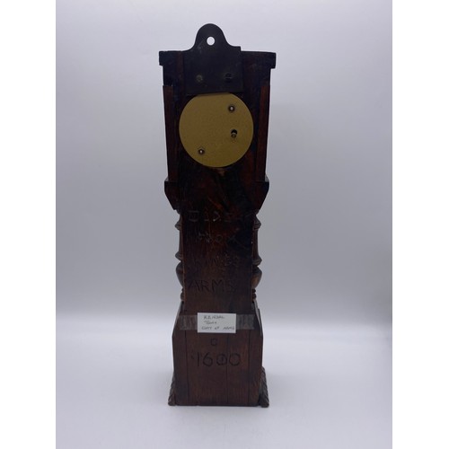 499 - QUARTZ CLOCK IN A CARVED OAK LONG CASE HEIGHT 39CM APPROX