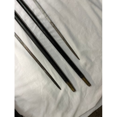 620 - PAIR OF INDIAN EBONISED AND BONE SWORD STICKS BLADE IS 75CM APPROX