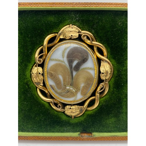 555 - VICTORIAN UNMARKED YELLOW METAL CASED PORTRAIT MINIATURE WITH HAIR LOCKET VERSO HOUSED IN A LEATHER ... 