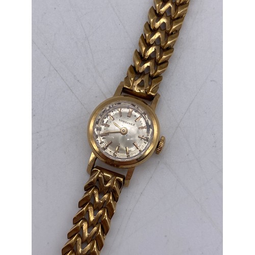 551 - LADIES LONGINES CIRCULAR WRIST WATCH ON AN UNMARKED YELLOW METAL HERRING BONE BRACELET STRAP 29G OVE... 