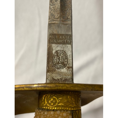 623 - NAVAL DRESS SWORD WITH A CARL EICKHORN SOLINGEN ETCHED DAMASCENED FULLERED BLADE, EAGLES HEADED GILD... 