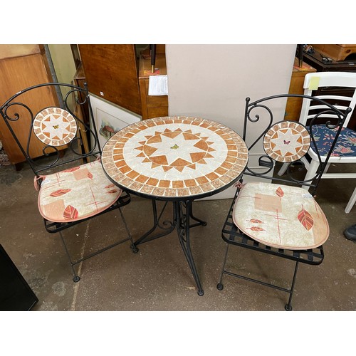 130 - MOSAIC TOP CIRCULAR PATIO TABLE AND TWO FOLDING LATTICE SEAT CHAIRS