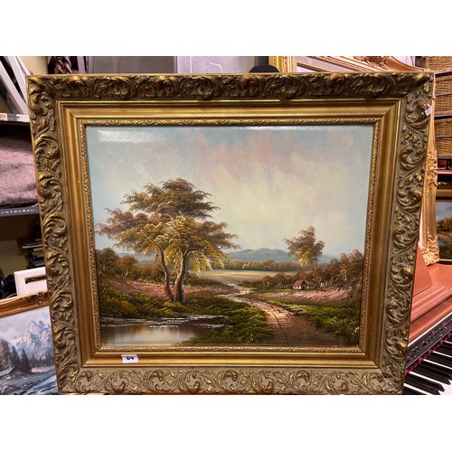 64 - PAINTING ON CANVAS OF TREES BY A LAKE IN GILT FRAME