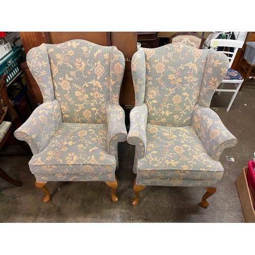 115 - PAIR OF PARKER KNOLL PALE BLUE FLORAL WING BACK ARMCHAIRS