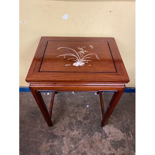 134 - CHINESE INSPIRED ROSEWOOD NEST OF FOUR TABLES INLAID WITH FLOWERS AND INSECT DECORATION