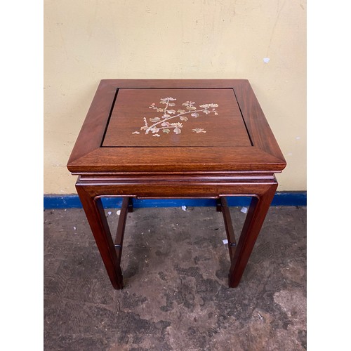 134 - CHINESE INSPIRED ROSEWOOD NEST OF FOUR TABLES INLAID WITH FLOWERS AND INSECT DECORATION