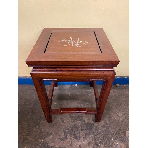 134 - CHINESE INSPIRED ROSEWOOD NEST OF FOUR TABLES INLAID WITH FLOWERS AND INSECT DECORATION