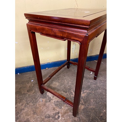 134 - CHINESE INSPIRED ROSEWOOD NEST OF FOUR TABLES INLAID WITH FLOWERS AND INSECT DECORATION