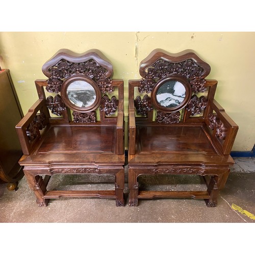 142 - PAIR OF CHINESE CARVED HARDWOOD ELBOW CHAIRS WITH VARIEGATED MARBLE ROUNDEL PANEL BACKS AND SOLID SE... 